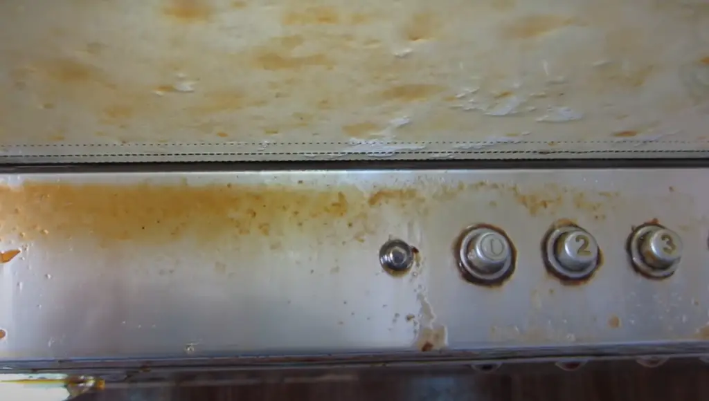 What dissolves grease on stainless steel?
