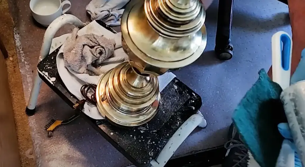 Why is it important to clean brass lamps?